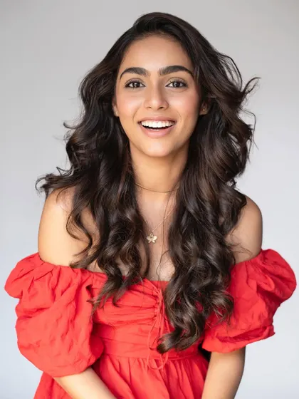 A joyful, expressive shot that shows how well the hair and makeup move and look in action.