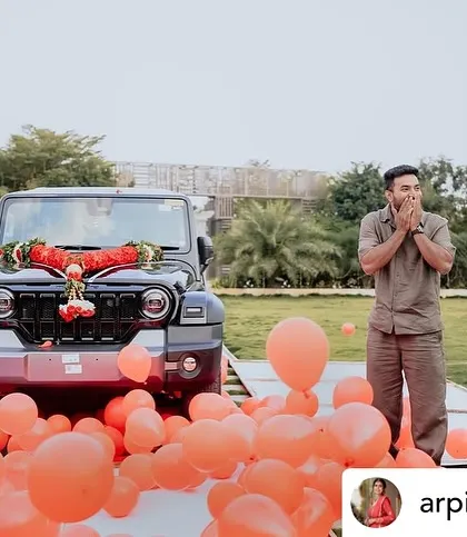 The pure shock and joy of a perfectly executed surprise. We filled the area around the car with balloons to make the reveal even more festive and photogenic.