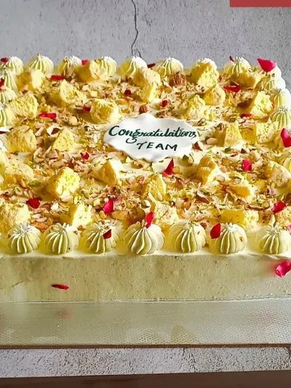 This large, square Rasmalai Cake was made for a corporate team celebration. It's a great option for office parties, offering the unique taste of my fusion baking in a size that's perfect for sharing.