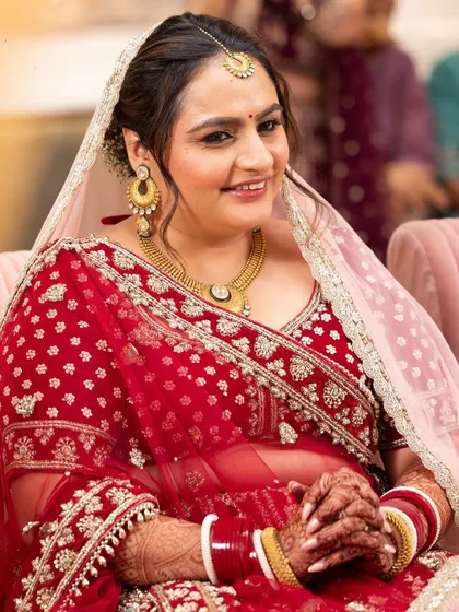 A closer look at Rashi's wedding day makeup. The soft brown eyeshadow and natural lip color enhance her features without being overpowering.