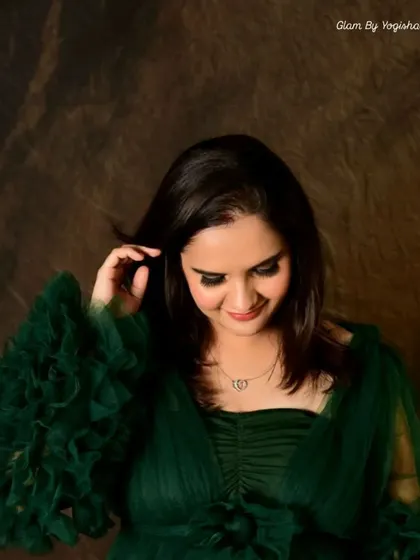 A stunning green smokey eye look. This non-edited photo shows the true color and blend of the makeup, perfect for complementing a green outfit.