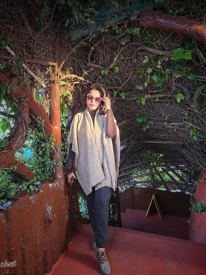 Good basics are the foundation of any wardrobe. A simple poncho over black pants is a timeless and comfortable outfit.