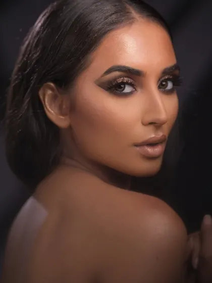 Full glam for a fashion shoot. This look features a bronze smokey eye, sharp contouring, and a nude lip, a classic combination for commercial fashion work.