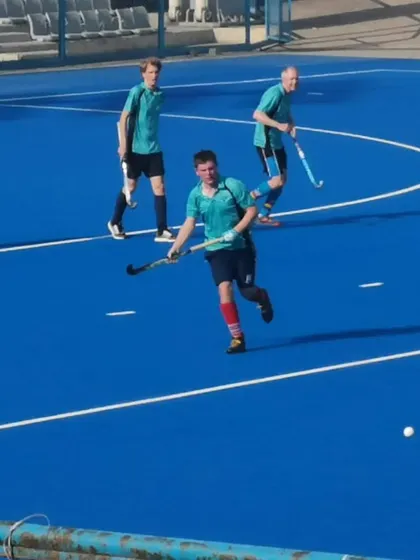 A player carries the ball upfield, looking to start an attack. We train our players to be confident and creative with the ball.