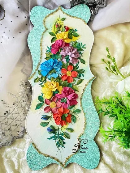 Another view of the vertical wall panel, showing its elegant shape and the vibrant floral arrangement that flows down its center.