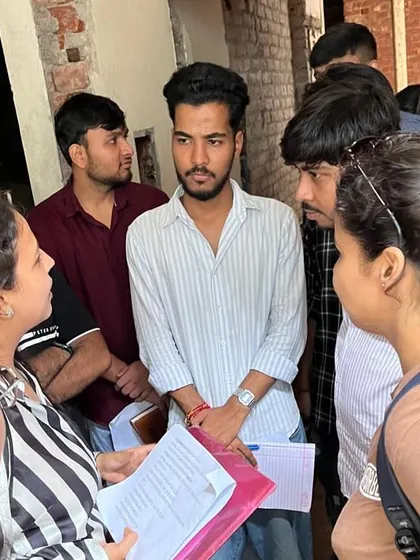 A close-up of the interactive learning session during the Vastu site visit, where students analyze the building's layout.