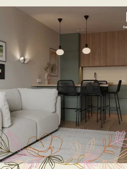 This view shows the integration of the living space with the kitchen peninsula, which doubles as a breakfast bar, maximizing functionality in a smaller footprint.