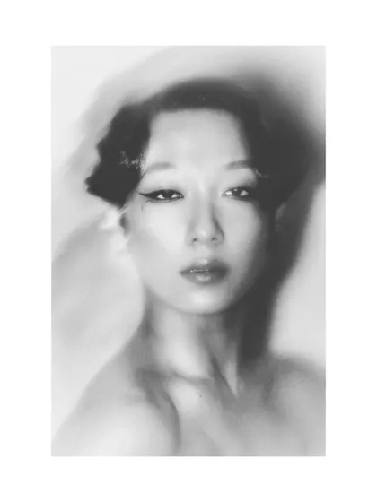 A soft-focus, black and white portrait of Patricia. This technique creates a dreamy, timeless quality, focusing on mood and emotion rather than sharp detail.