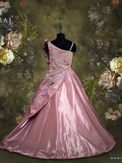 Embrace the beauty of peach blossoms with this stunning off-shoulder gown, delicately adorned with floral appliqué.
