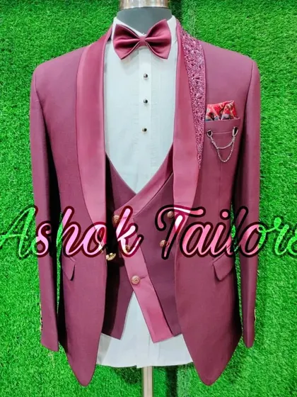 A maroon three-piece suit with a sequined lapel and a stylish pocket chain. It's all about the details.