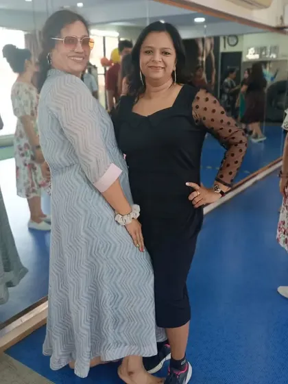 Two members posing during the Women's Day event. Our studio is a place where strong friendships are formed.