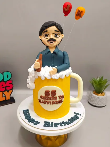 Cheers to 55 years! This beer mug cake, complete with a custom fondant figurine of the birthday man, was a fun recreation of an AI image sent by the client.