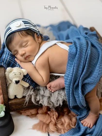 Tucked in with a cozy blue blanket for his nap. I love adding simple elements like a blanket to change the look and feel of a setup.