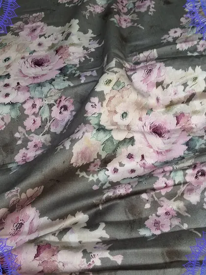 A beautiful grey fabric with a soft pink floral digital print. The elegant design and smooth texture make it ideal for creating sophisticated dresses and tops.