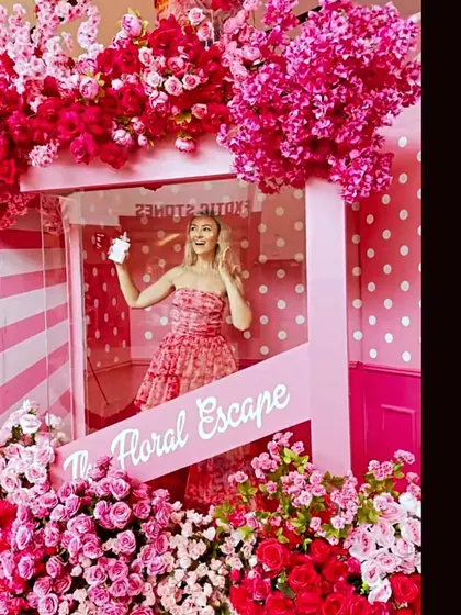 A floral escape selfie booth is a fantastic idea for a bachelorette party or mehendi night. The vibrant pink flowers and fun setup create a perfect spot for memorable pictures.