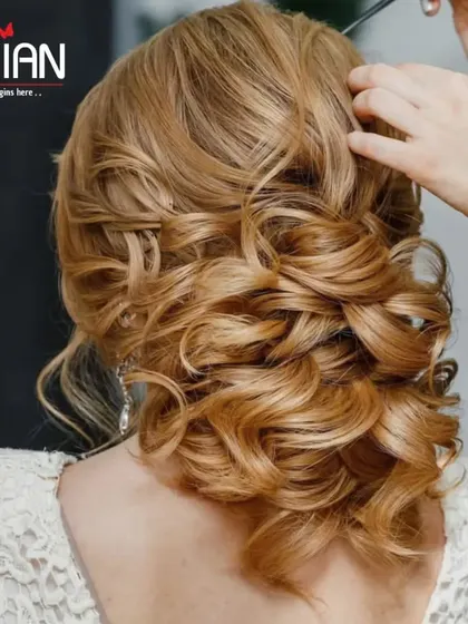 A classic hair updo for a wedding or special event. We create intricate and secure hairstyles, from elegant curls to sophisticated buns, that are designed to last all day.