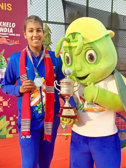 Kashish Bhatia proudly displays her silver medal and runner-up trophy at the Khelo India University Games in Guwahati.