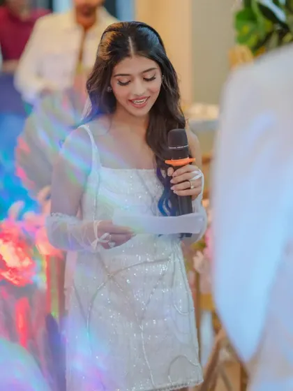 Utsavi reading her vows. Her makeup is soft and emotional, perfect for such a heartfelt moment.