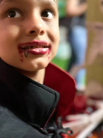 The effort is real! This close-up shows the detailed vampire makeup, complete with dripping blood, that makes a costume truly stand out.