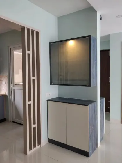 Another angle of the custom crockery unit, highlighting its unique design and how it complements the eclectic theme of the space.