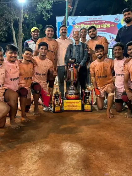 The complete winning squad posing with the championship trophy and individual awards.