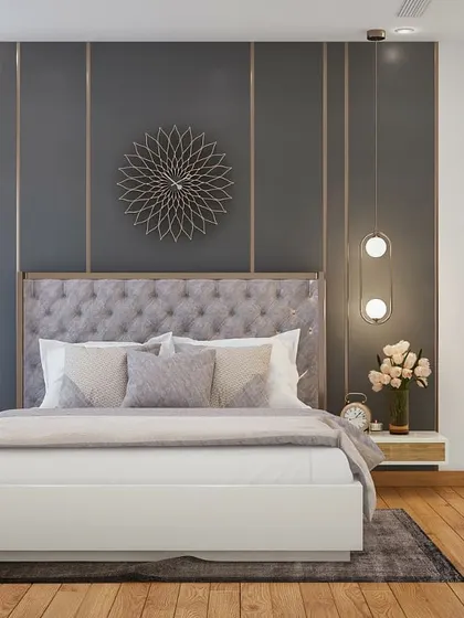 A 3D render of a master bedroom with a sophisticated grey accent wall featuring decorative molding and gold inlays, paired with a comfortable tufted headboard.