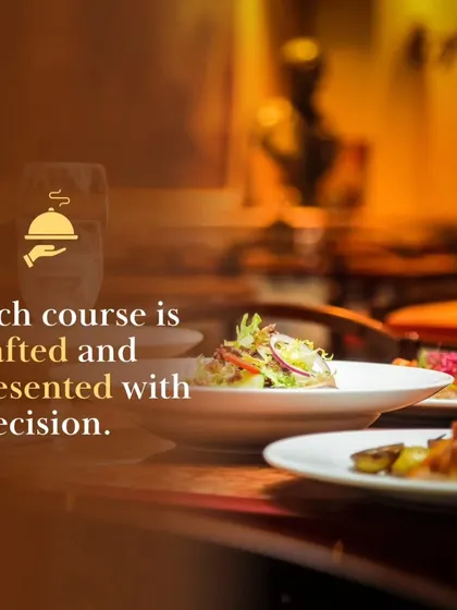 Each course is crafted and presented with precision. This image captures a beautifully plated salad on a dining table, reflecting our commitment to high-quality food presentation.
