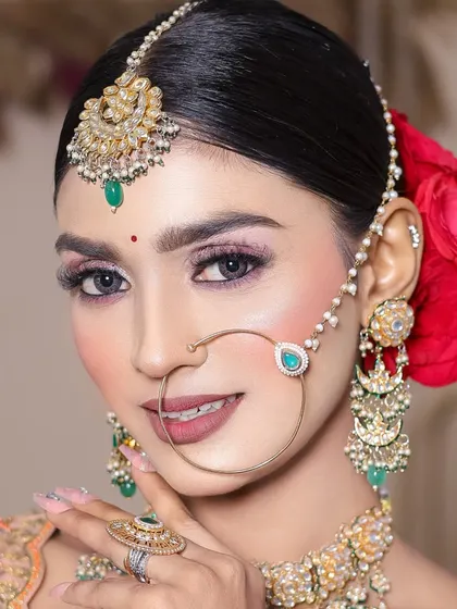 A student's work featuring a glittery pink eyeshadow look, perfect for a sangeet or reception.