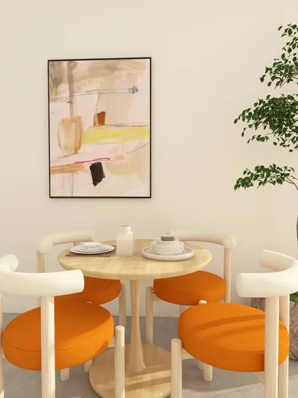 A minimal dining theme can be made interesting with pops of color. Here, the bright orange upholstery of the chairs contrasts beautifully with the light wood and white walls.
