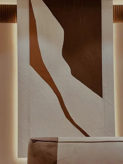 This backlit abstract art piece adds a layer of modern sophistication. The simple forms and textured surface create a warm, ambient glow, proving that minimalist art can have a huge impact.