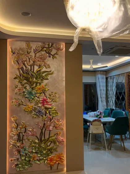 A vertical floral mural designed for a living room pillar, adding color and elegance to the space. The soft backlighting gives the flowers a gentle glow.