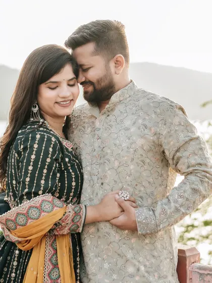 A close-up portrait capturing the gentle intimacy between a couple during their golden hour shoot at Jal Mahal.
