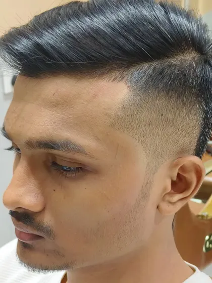 A sharp and clean haircut that enhances the client's features.