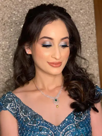 A pop of color for Rashvita's engagement. I added a shimmery swipe of blue on the eyelid to complement her stunning teal gown.