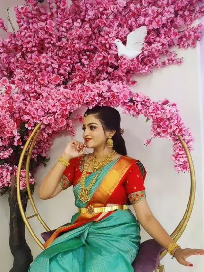 A full shot of the same client in a beautiful decorative swing. This shows a complete look in a festive setting.