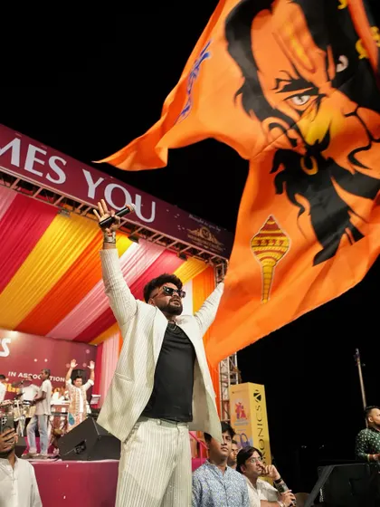 A moment of pride, holding up the saffron flag during a Navratri celebration.