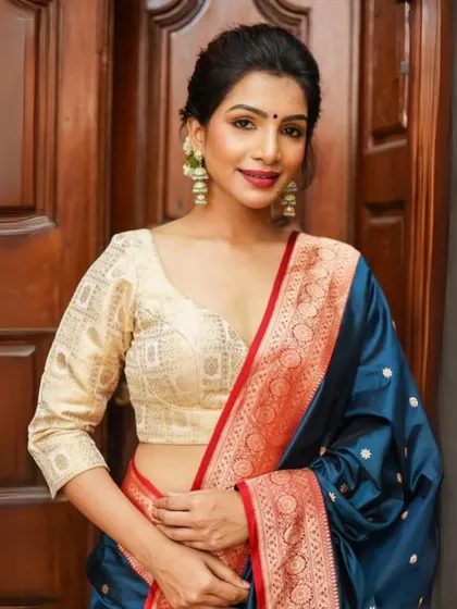 A classic look featuring a cream brocade blouse and statement earrings, perfect for any wedding or traditional event.