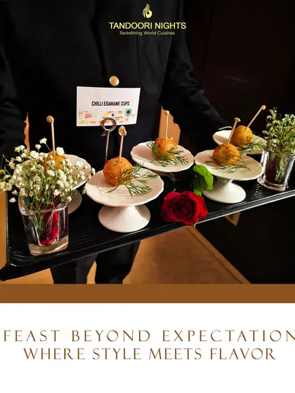 A feast beyond expectations. Our server presents a tray of chili edamame cups, showcasing how we combine elegant service with flavorful, stylish appetizers.
