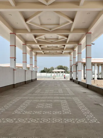 The detailed ceiling work and patterned floor tiles in the temple corridors show the level of craftsmanship integrated into the master plan.