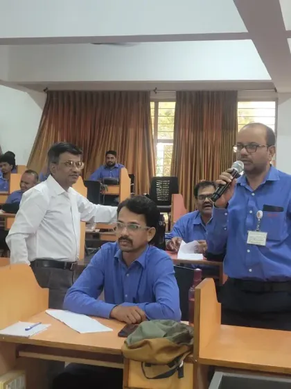 An interactive moment between a trainer and a participant during our session at Toyota Kirloskar. We encourage questions and active participation to create a dynamic learning environment.