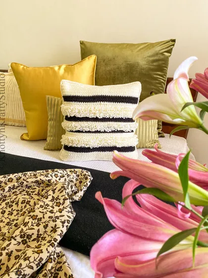 A closer look at the Scandi-Boho cushion, surrounded by fresh lilies. The combination of handmade texture and natural beauty is what I love most.