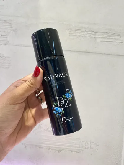 A hand-painted Dior Sauvage spray can from a live event. This shows the versatility of my work, adapting my art to different products and brand aesthetics.