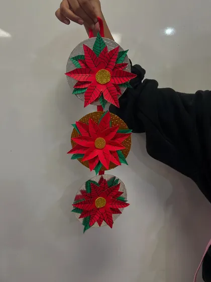 These 3D paper poinsettia ornaments are so elegant. My students did a wonderful job cutting and assembling these festive flowers.