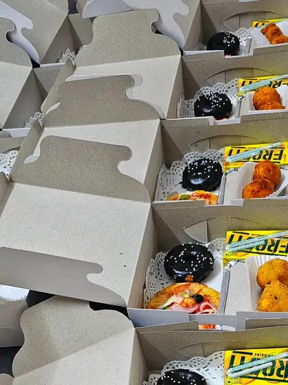 A look inside one of my customized snack boxes for a birthday girl. This one includes a mini pizza, cheese corn balls, a mini donut, and a juice box.