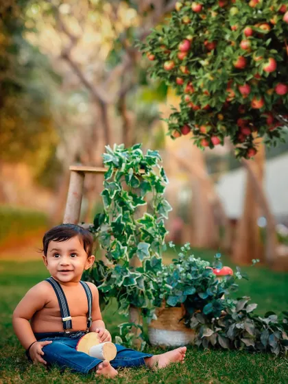 A slightly different pose from the apple orchard shoot, capturing his sweet expression as he sits in the grass.