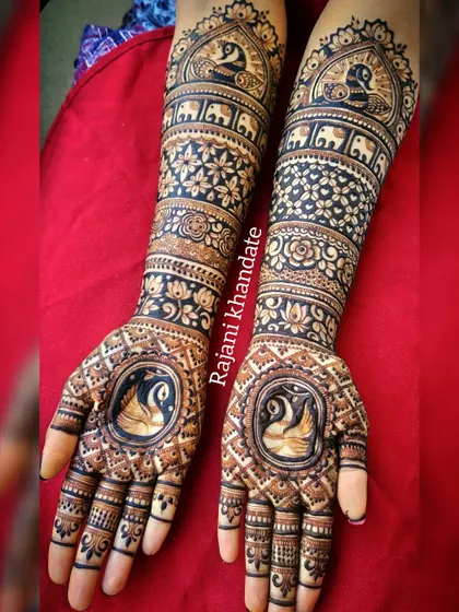 A duplicate of image 219, showcasing the beautiful swan, peacock, and elephant motifs in this full-arm bridal design.