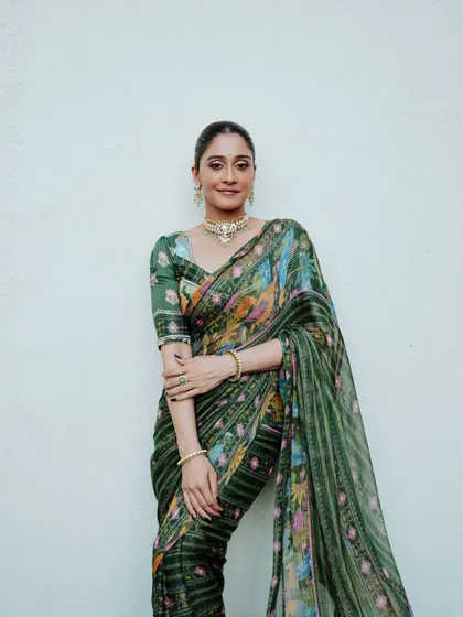 A poised and polished portrait against a clean white background, making the vibrant saree the hero of the image. This is ideal for fashion lookbooks and brand promotions.
