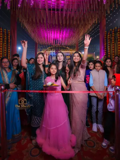 The bride's squad waiting for the groom's arrival at the ribbon-cutting ceremony. A fun tradition and a great photo opportunity with the bridesmaids.