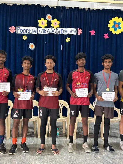 Celebrating our players' achievements. A group of our senior players receives certificates and medals, recognizing their hard work and success.