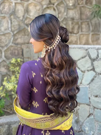 A stunning mehendi look for my beautiful bride. The half-up bun and soft waves are accessorized with a traditional passa for a regal and elegant finish.